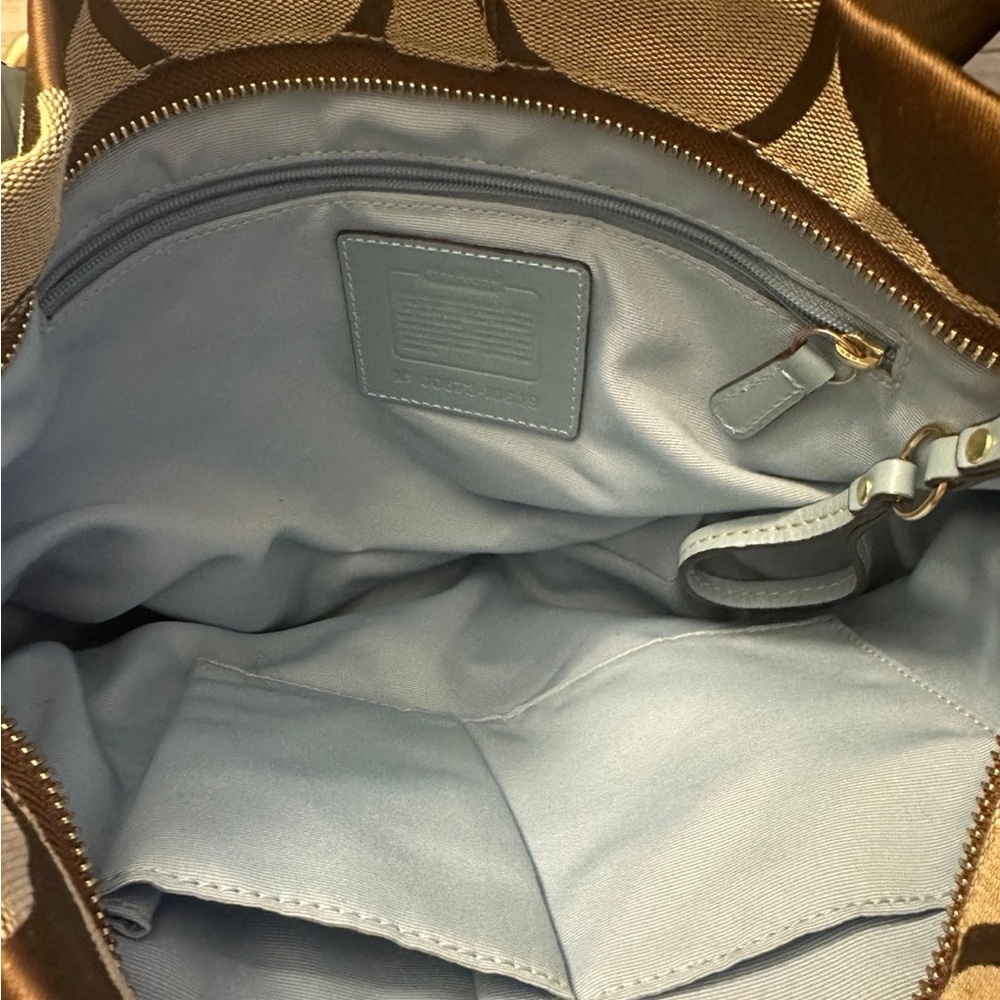 Coach Hobo bag. Light and dark brown with baby blue inside.